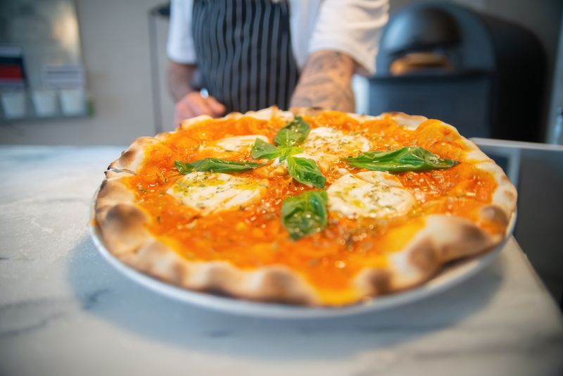 Chuys artisan wood-fired pizza with fresh toppings